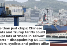 A cargo ship and containers are seen at the Port of Keelung in Taiwan on April 3, 2025. I-HWA CHENG/AFP via Getty Images